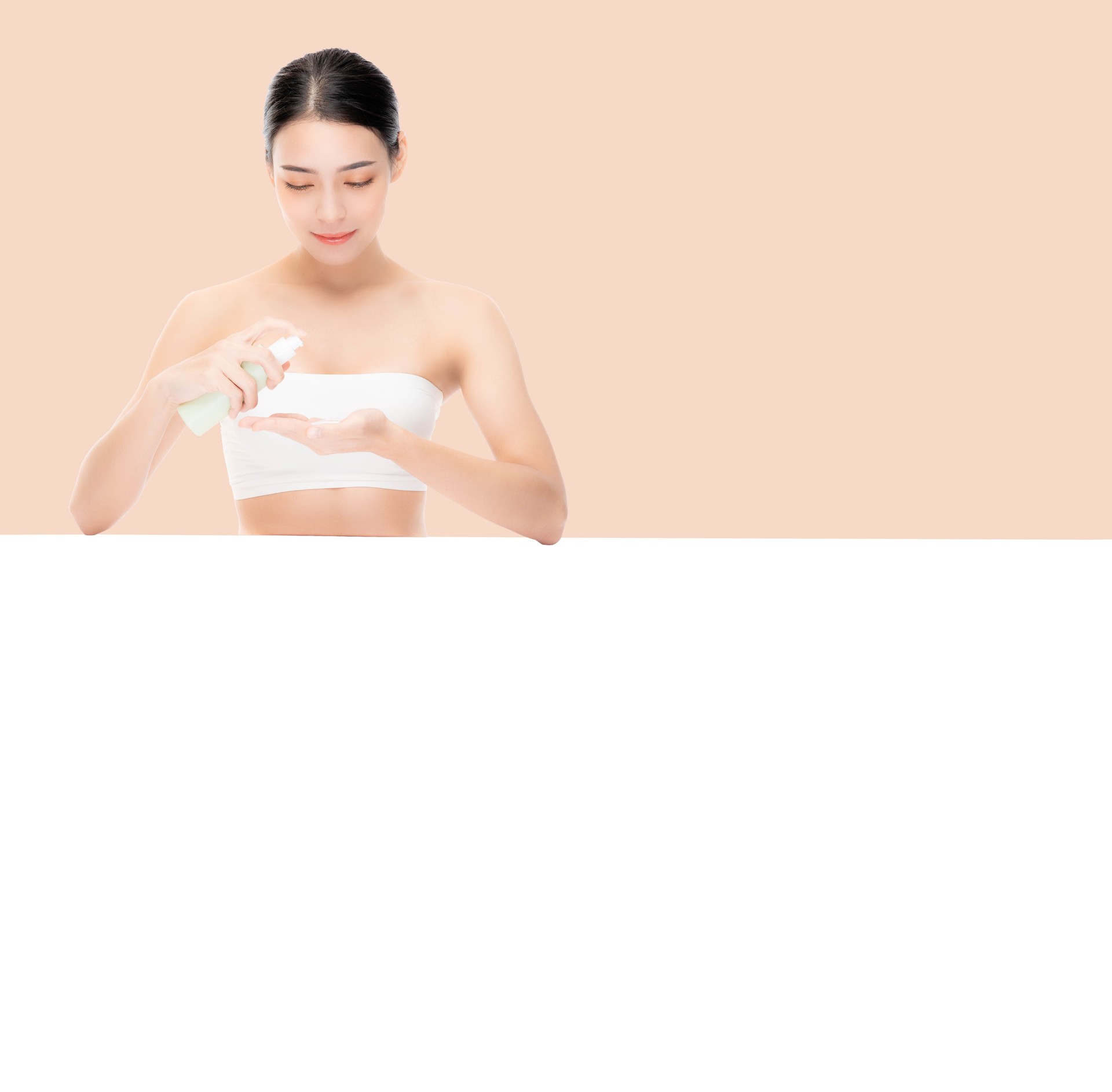 Beautiful woman put moisturizer cream on her beauty hand for apply cream to her body skin and facial skin Beauty girl or unrecognizable person holding moisturizer cream bottle isolated on white